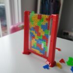 Joc de inteligenta Tetris puzzle tangram Embo, 70 de piese multicolore, 3D, montessori, interactiv, din plastic, zar inclus, sac depozitare piese, varsta peste 6 ani, 23 x 19.8 x 5 cm, cadru rosu - imagine 8