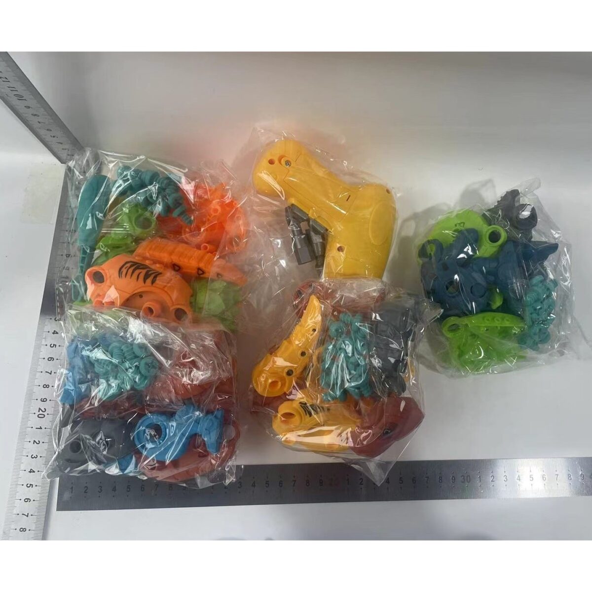 Set de Constructie/Asamblare, Embo, 4 Dinozauri, cu Bormasina Electrica, Baterii 2 x AA, Surubelnita si Cutie Depozitare, 22.5 x 14.5 x 15 cm, Multicolor - imagine 9