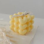 Lumanare Parfumata Decorativa, Embo, Model Abstract Cub din Inimioare, Lumanare pentru Diferite Ocazii, 6 x 5.5 cm, Aroma de Musetel, Galben