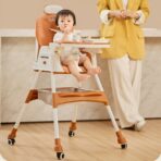 Scaun de Masa pentru Bebelusi si Copii Embo, cu Roti, cu Tetiera, Telescopic, Pliabil, Masuta Reglabila, Suport Picioare, Scaun cu Invelis Piele Artificiala, Centura Siguranta, Spatiu Depozitare, 97 x 73 x 65 cm, Maro - imagine 8